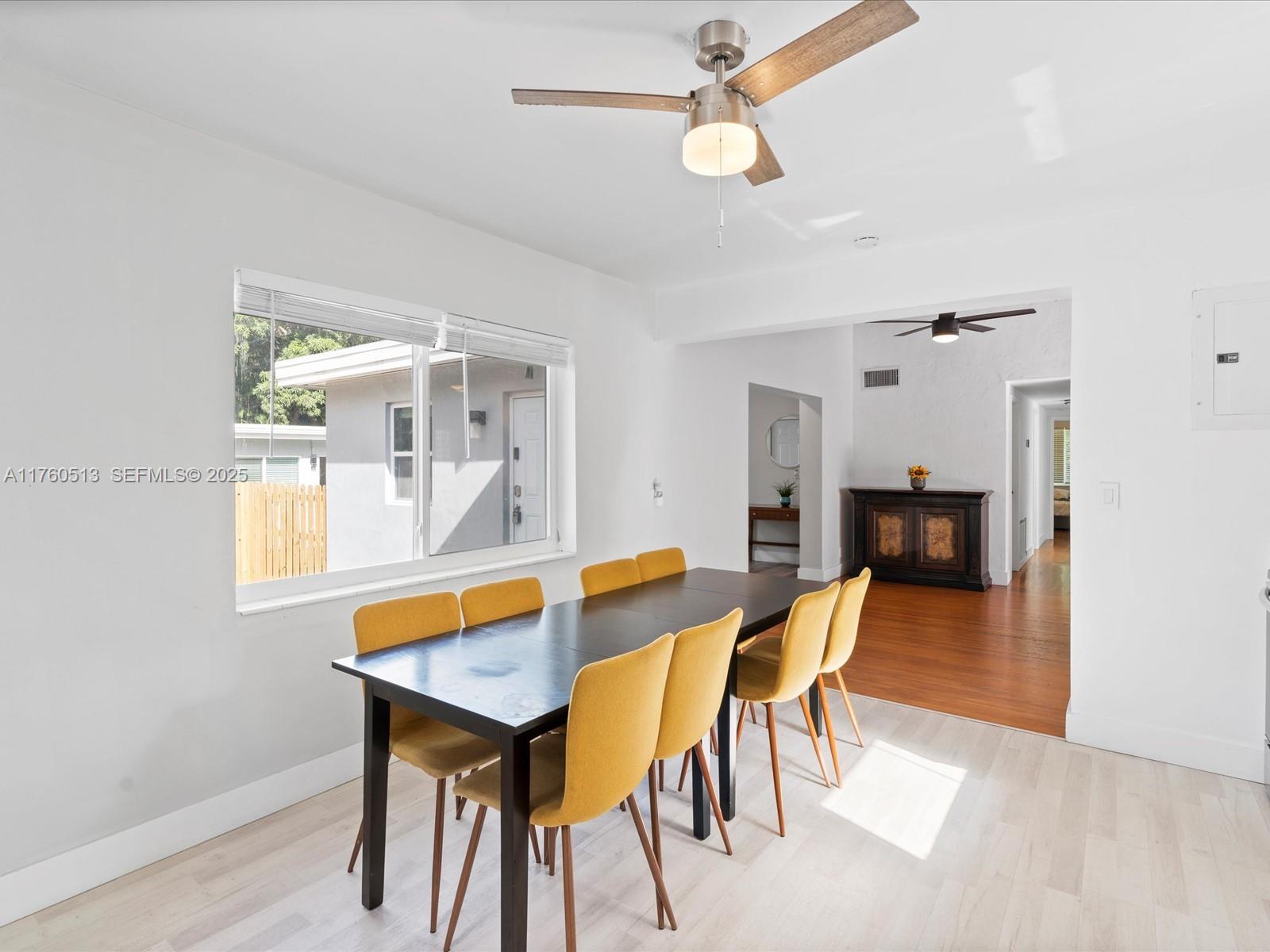3981 Southwest 58th Street Dania Beach, FL 33312 - Photo 9 of 37 a view of a dining room with furniture and wooden floor