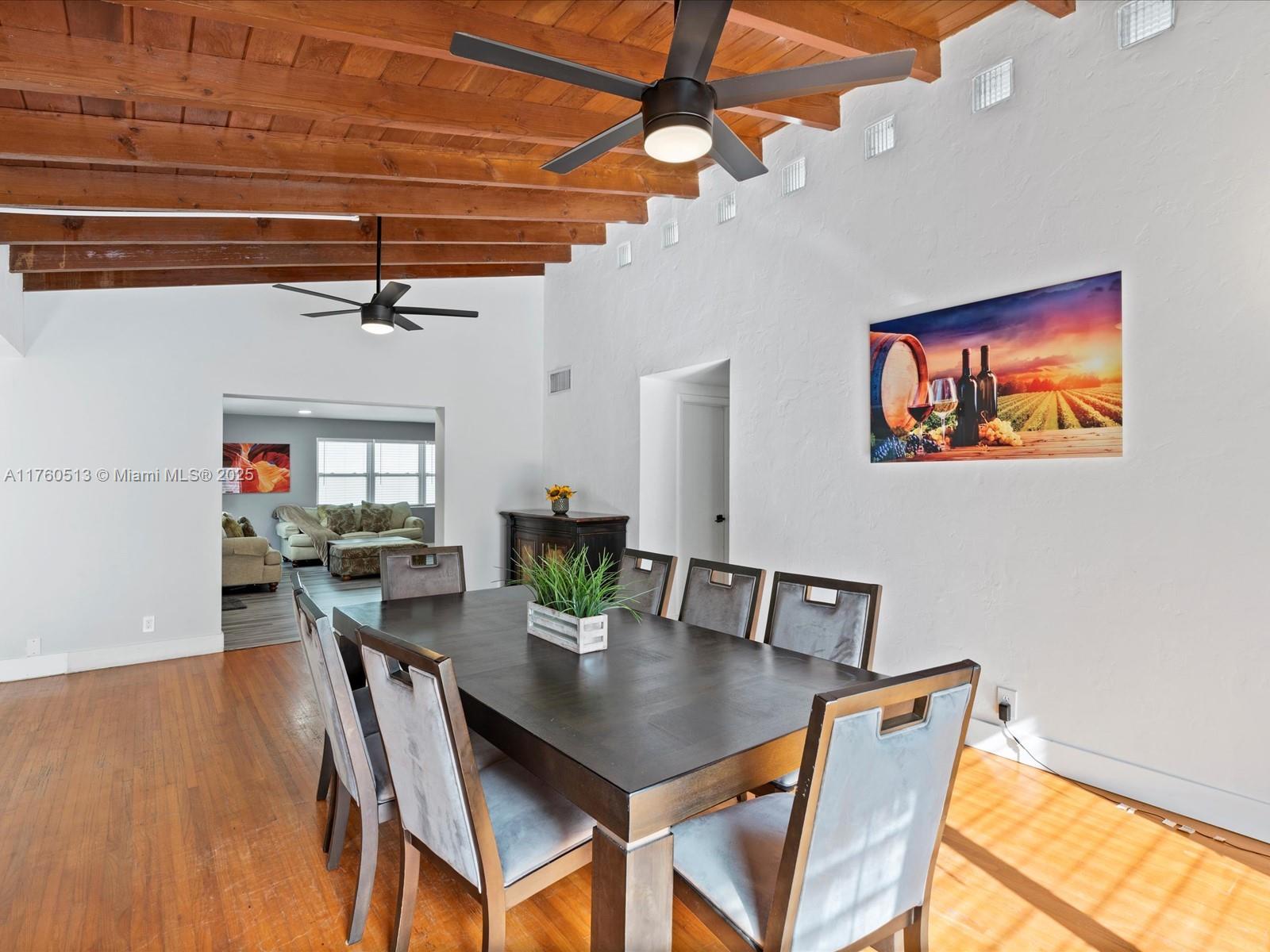 3981 Southwest 58th Street Dania Beach, FL 33312 - Photo 10 of 37 a view of a dining room with furniture and wooden floor