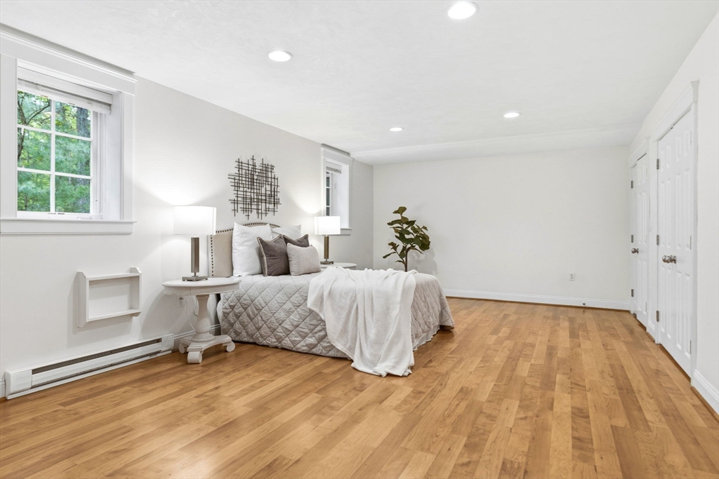 244 Musterfield Road Concord, MA 01742 - Photo 34 of 42 a bed room with a bed and a chair