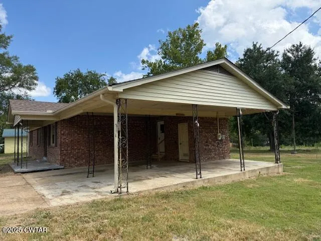 a backyard of a house with lots of green space