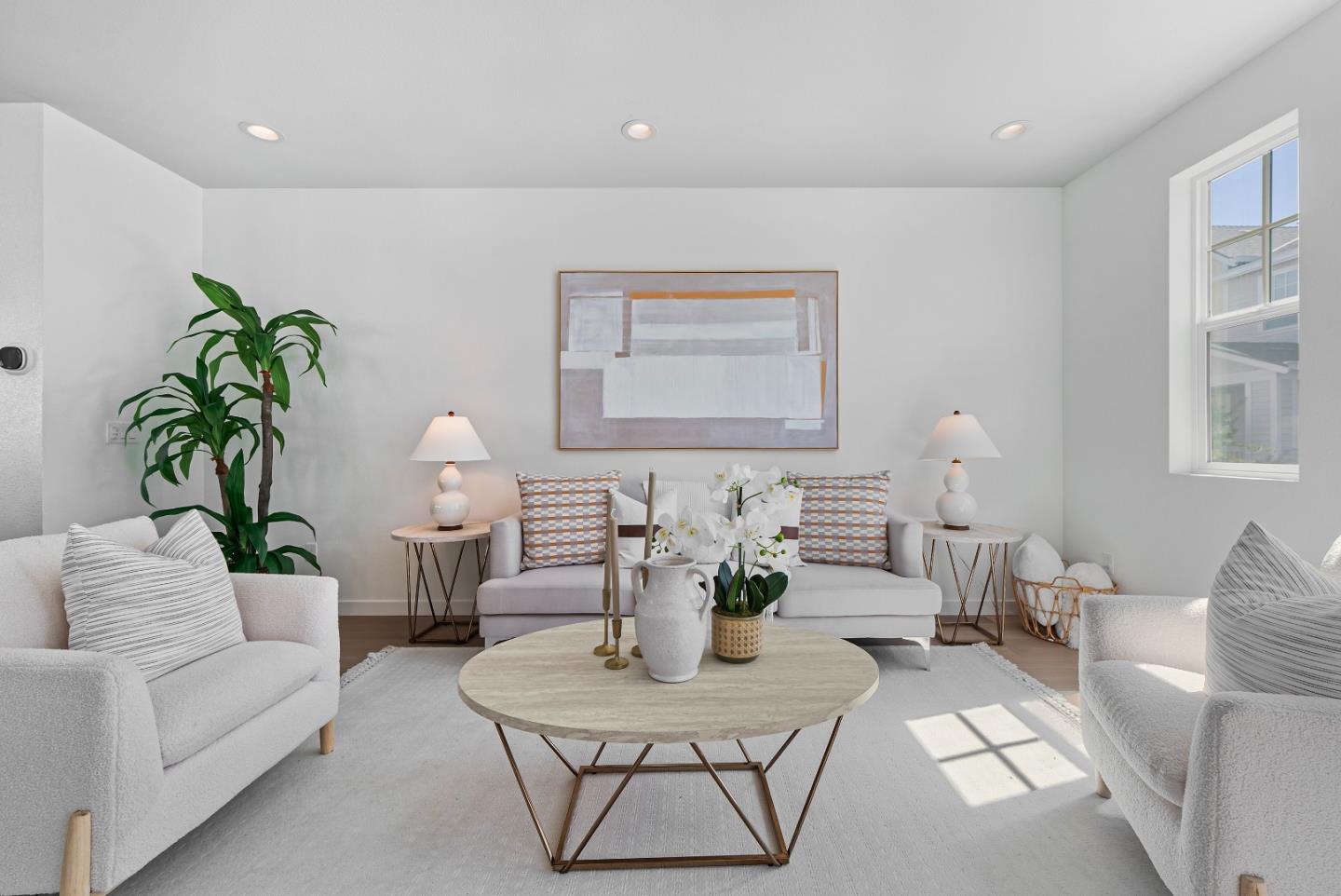 a living room with furniture potted plant and a window