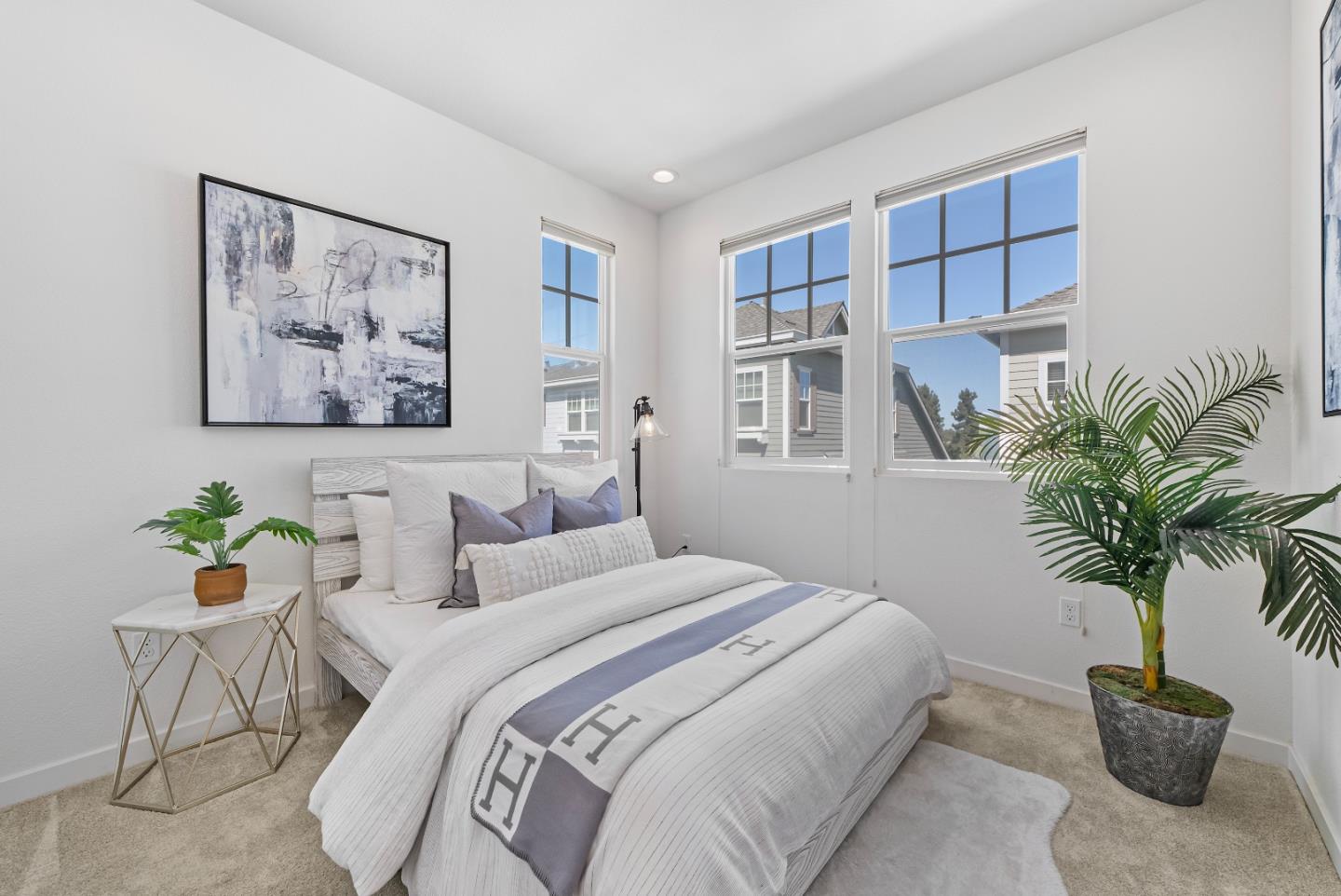 119 Orbit Way Mountain View, CA 94043 - Photo 21 of 46 a bedroom with a large bed and a potted plant