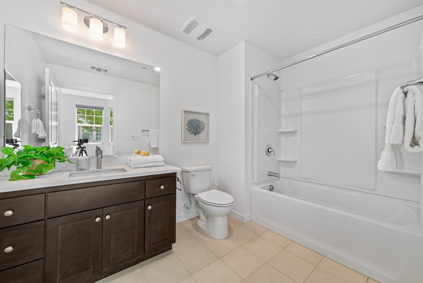 119 Orbit Way Mountain View, CA 94043 - Photo 32 of 46 a bathroom with a double vanity sink toilet and shower