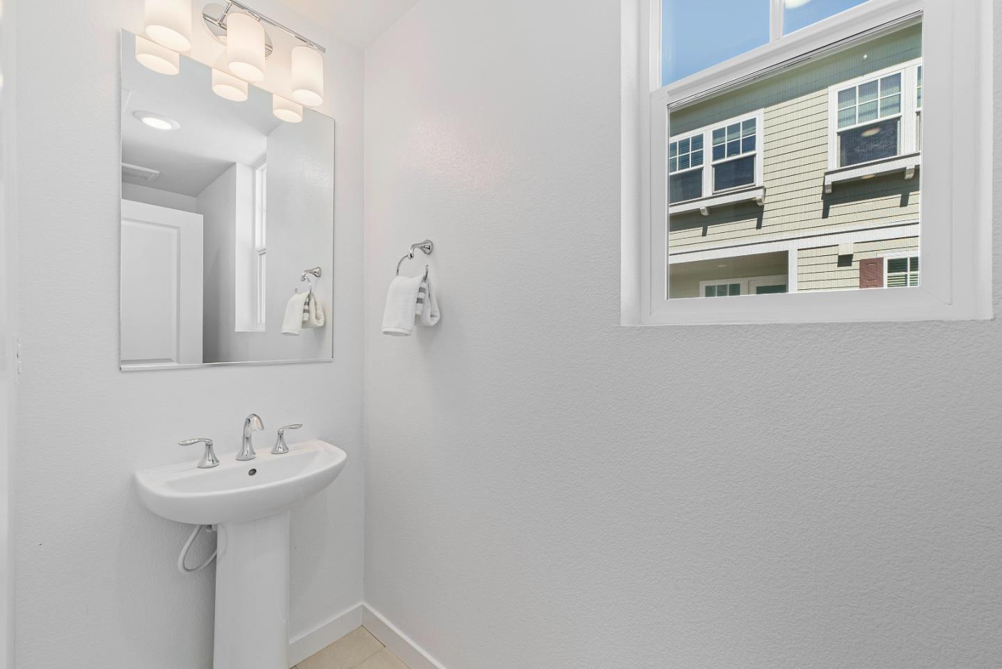 119 Orbit Way Mountain View, CA 94043 - Photo 33 of 46 a bathroom with a sink a mirror and a shower