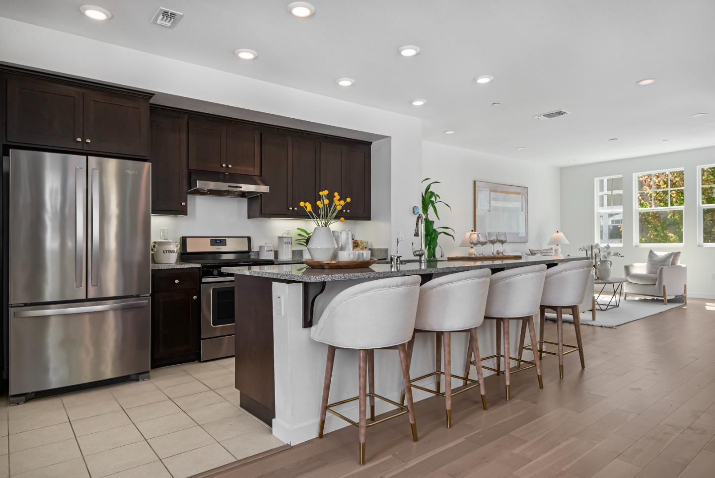 119 Orbit Way Mountain View, CA 94043 - Photo 5 of 46 a kitchen with stainless steel appliances granite countertop a refrigerator a stove a sink a dining table and chairs