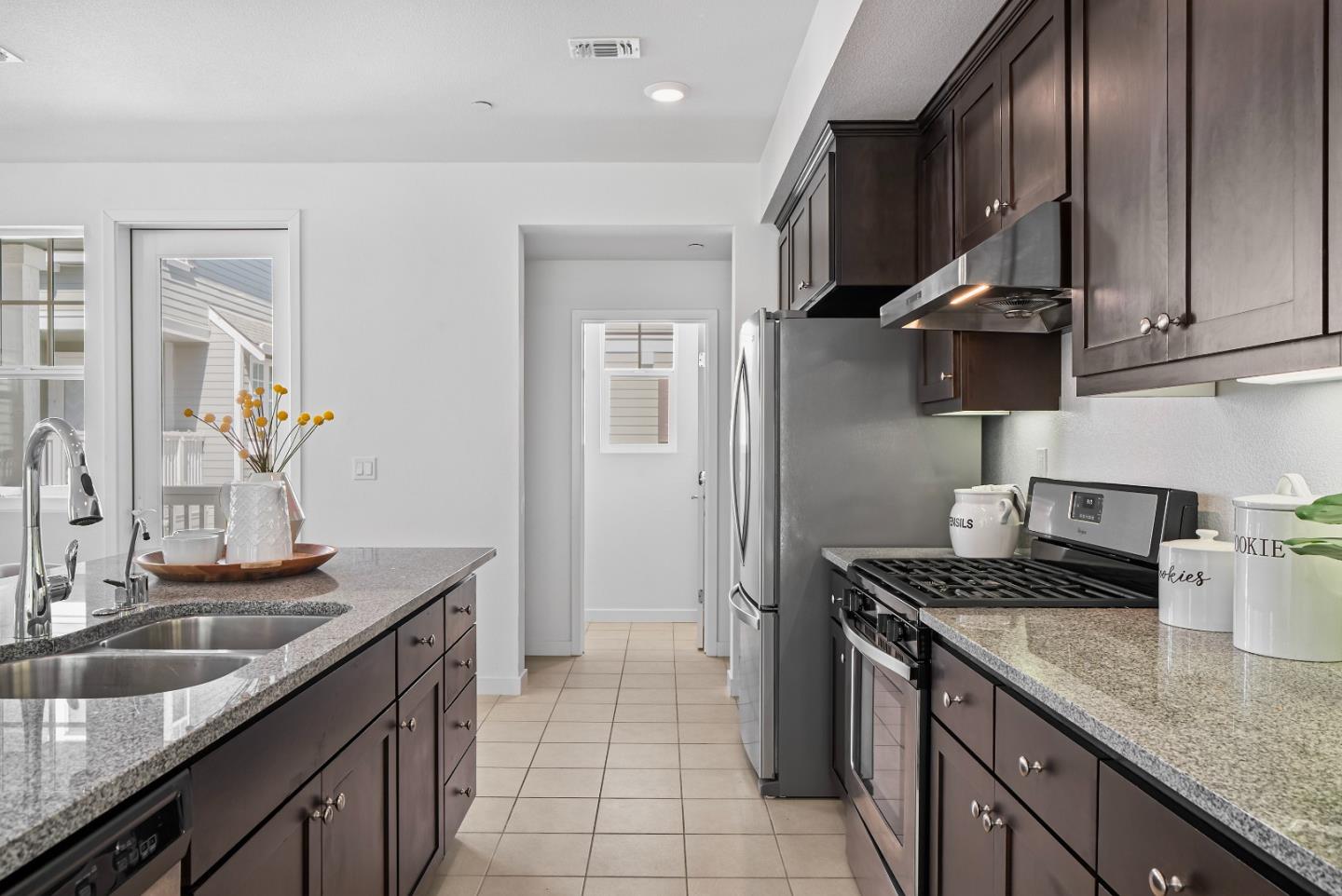 119 Orbit Way Mountain View, CA 94043 - Photo 6 of 46 a kitchen with stainless steel appliances granite countertop a sink stove and refrigerator