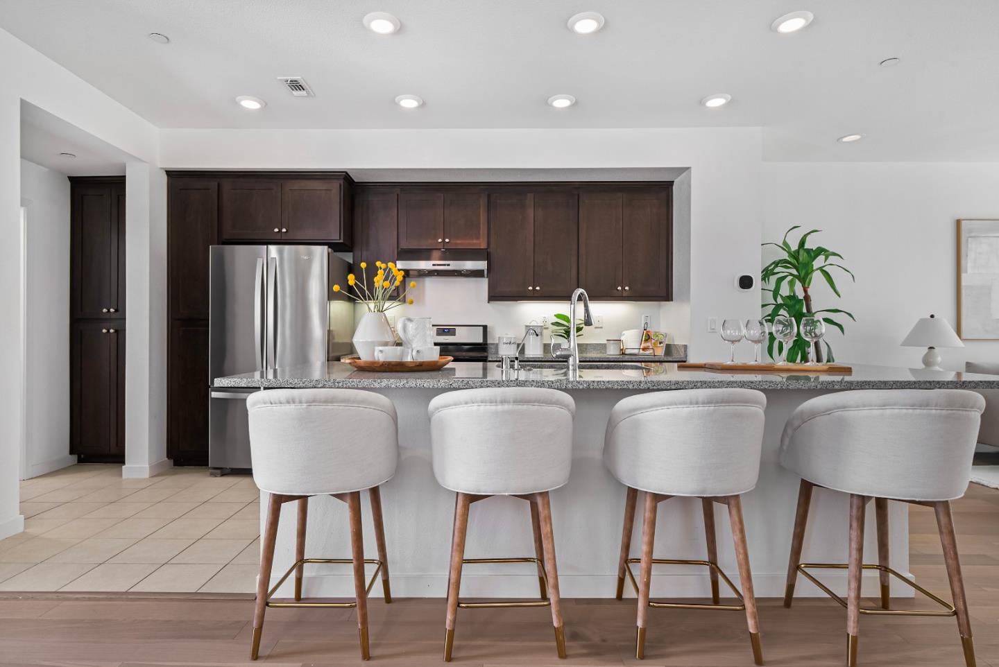 119 Orbit Way Mountain View, CA 94043 - Photo 7 of 46 a kitchen with stainless steel appliances a dining table chairs refrigerator and a sink