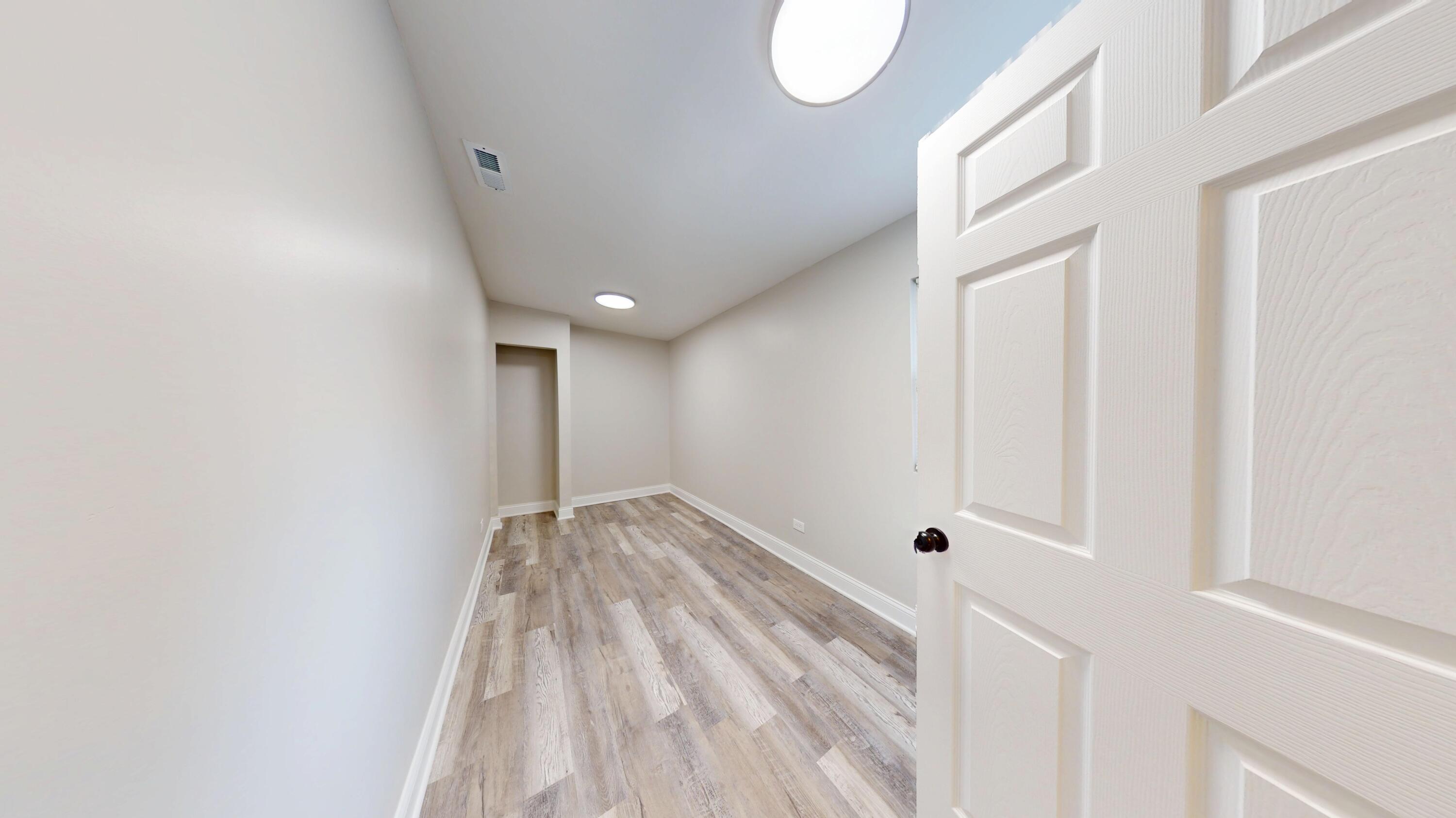 1379 Roosevelt Place Gary, IN 46404 - Photo 27 of 50 a view of empty room with wooden floor