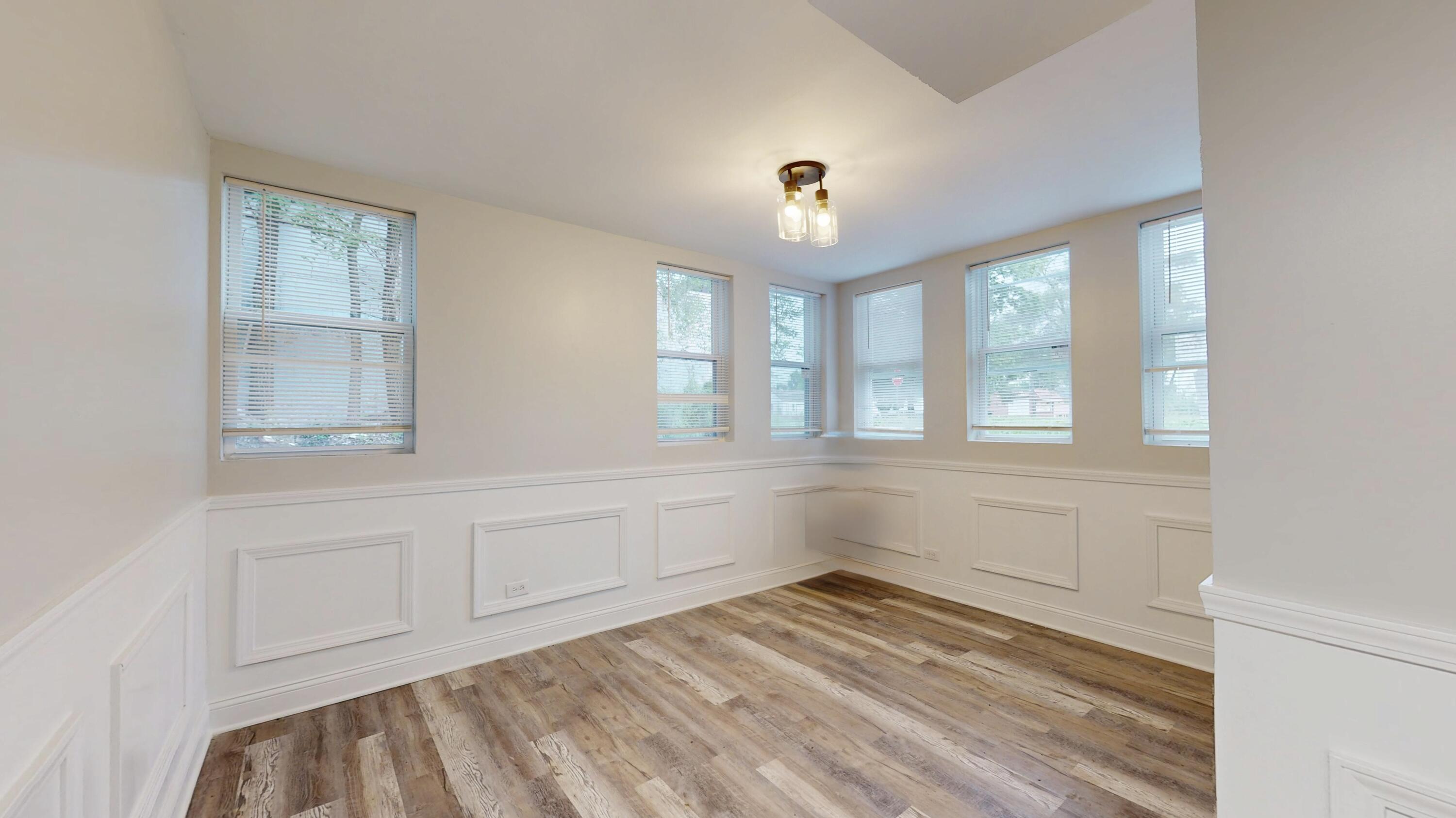 1379 Roosevelt Place Gary, IN 46404 - Photo 30 of 50 a view of empty room with wooden floor and fan