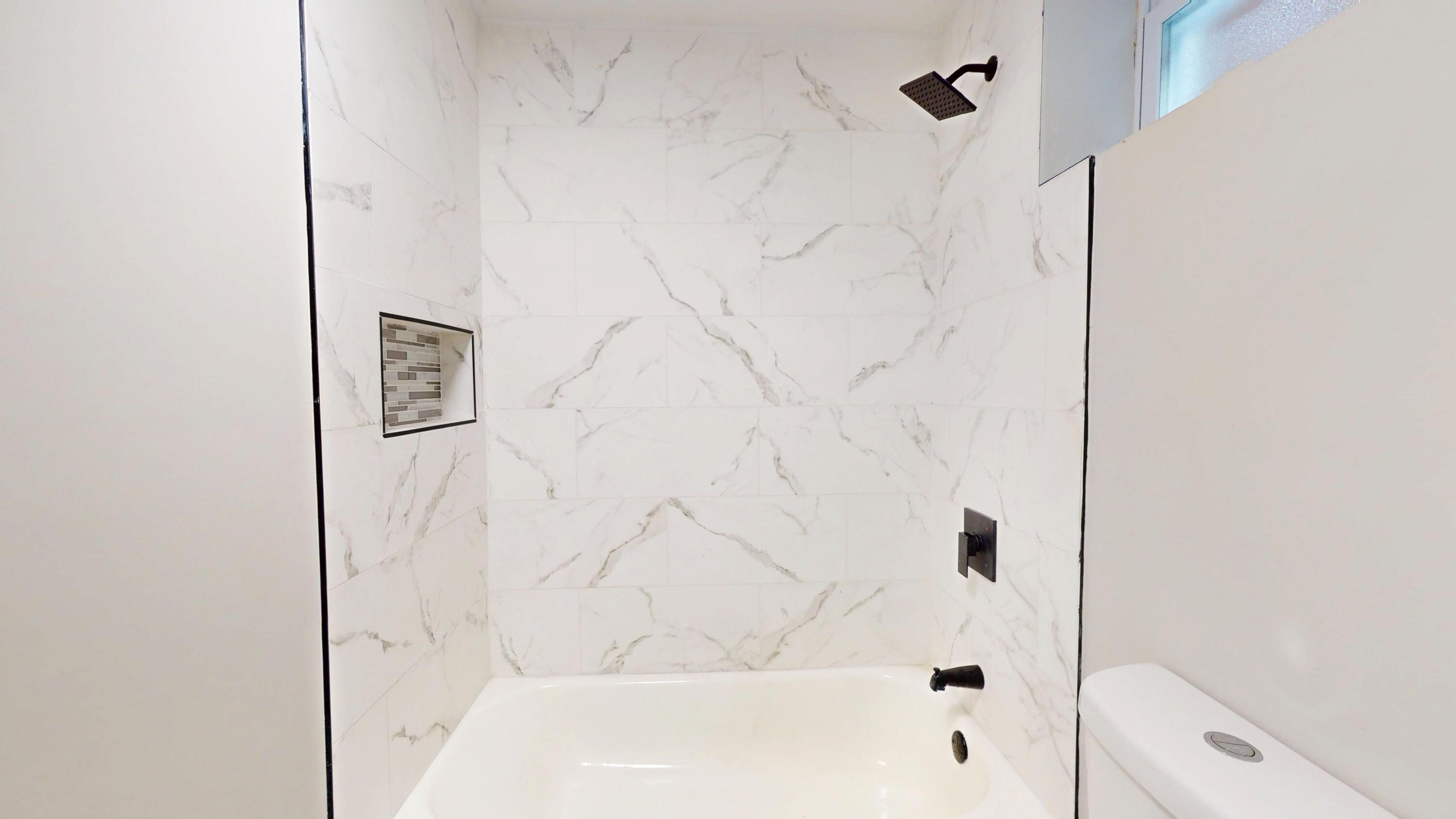 1379 Roosevelt Place Gary, IN 46404 - Photo 36 of 50 a bathroom with a bathtub