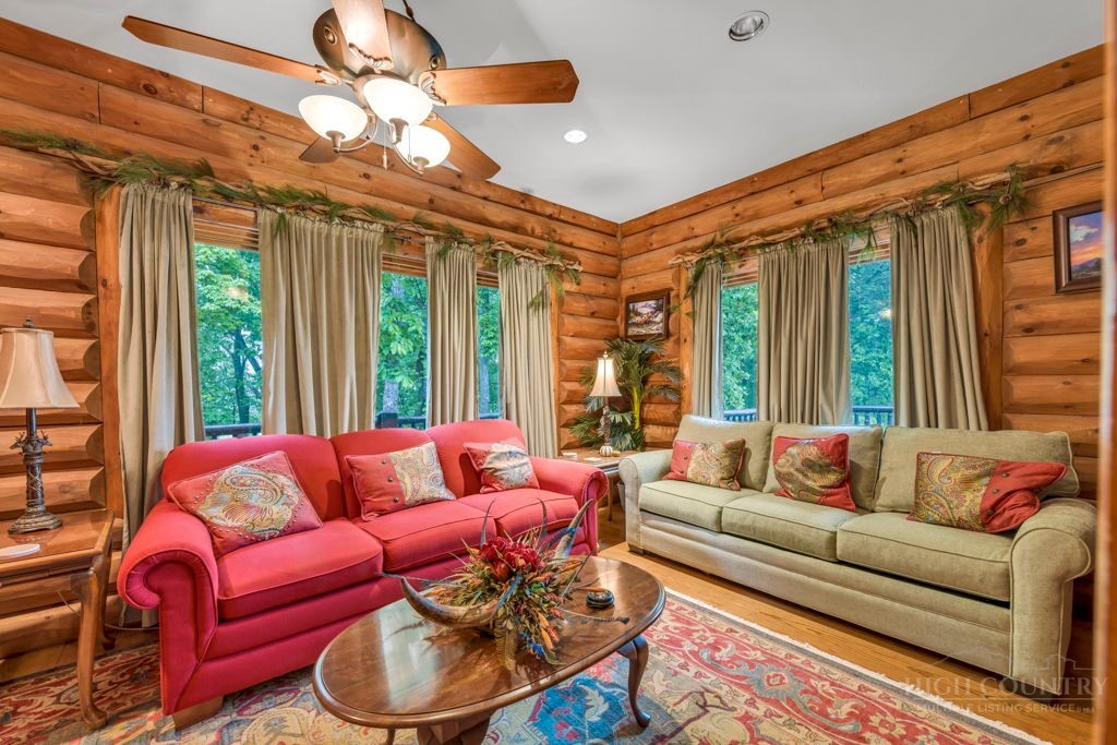 160 Outback Road Ferguson, NC 28624 - Photo 25 of 49 a living room with furniture and a large window