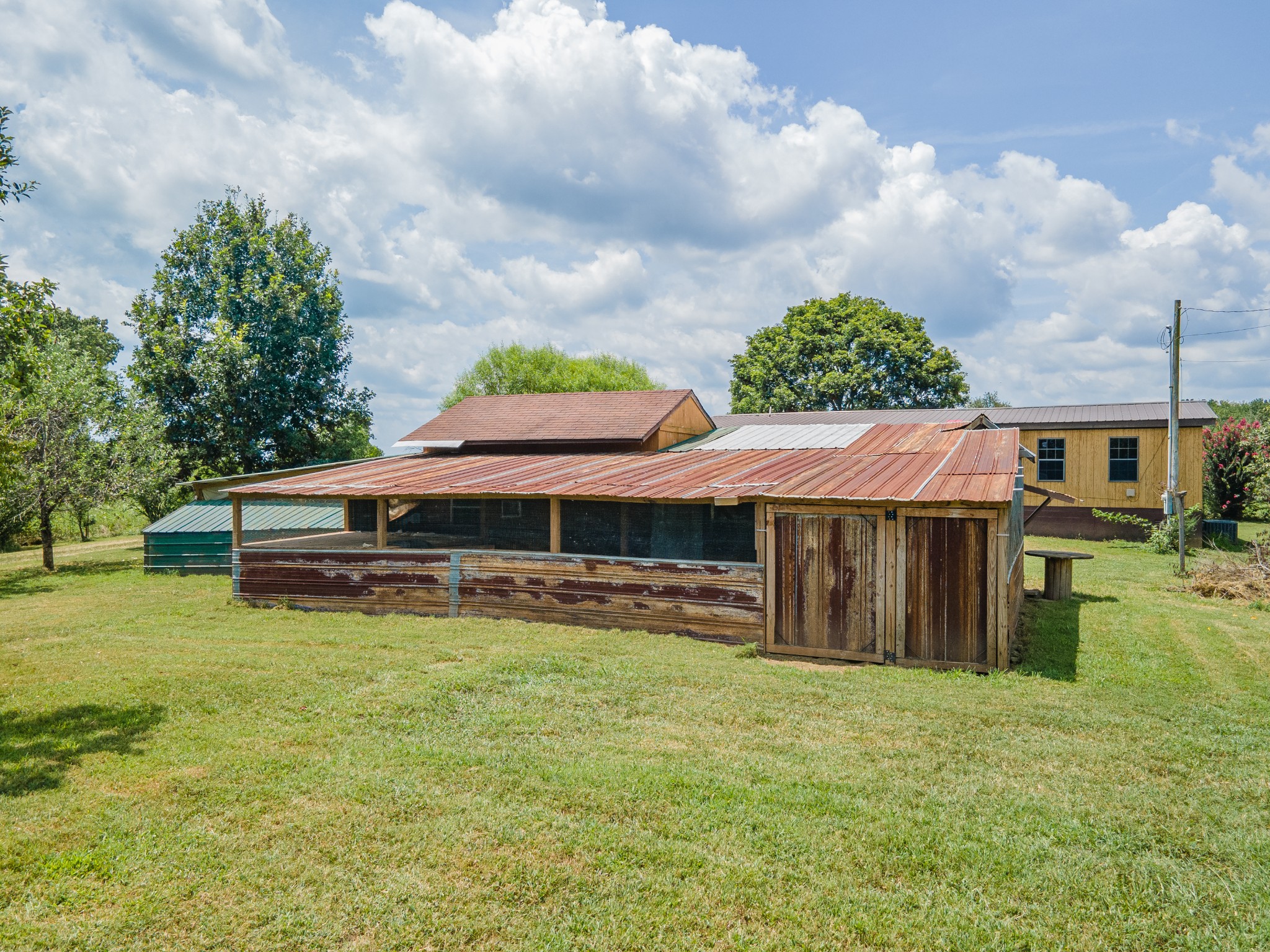 915 Maddox Road Centerville, TN 37033 - Photo 59 of 90 a view of a house with a yard and sitting area