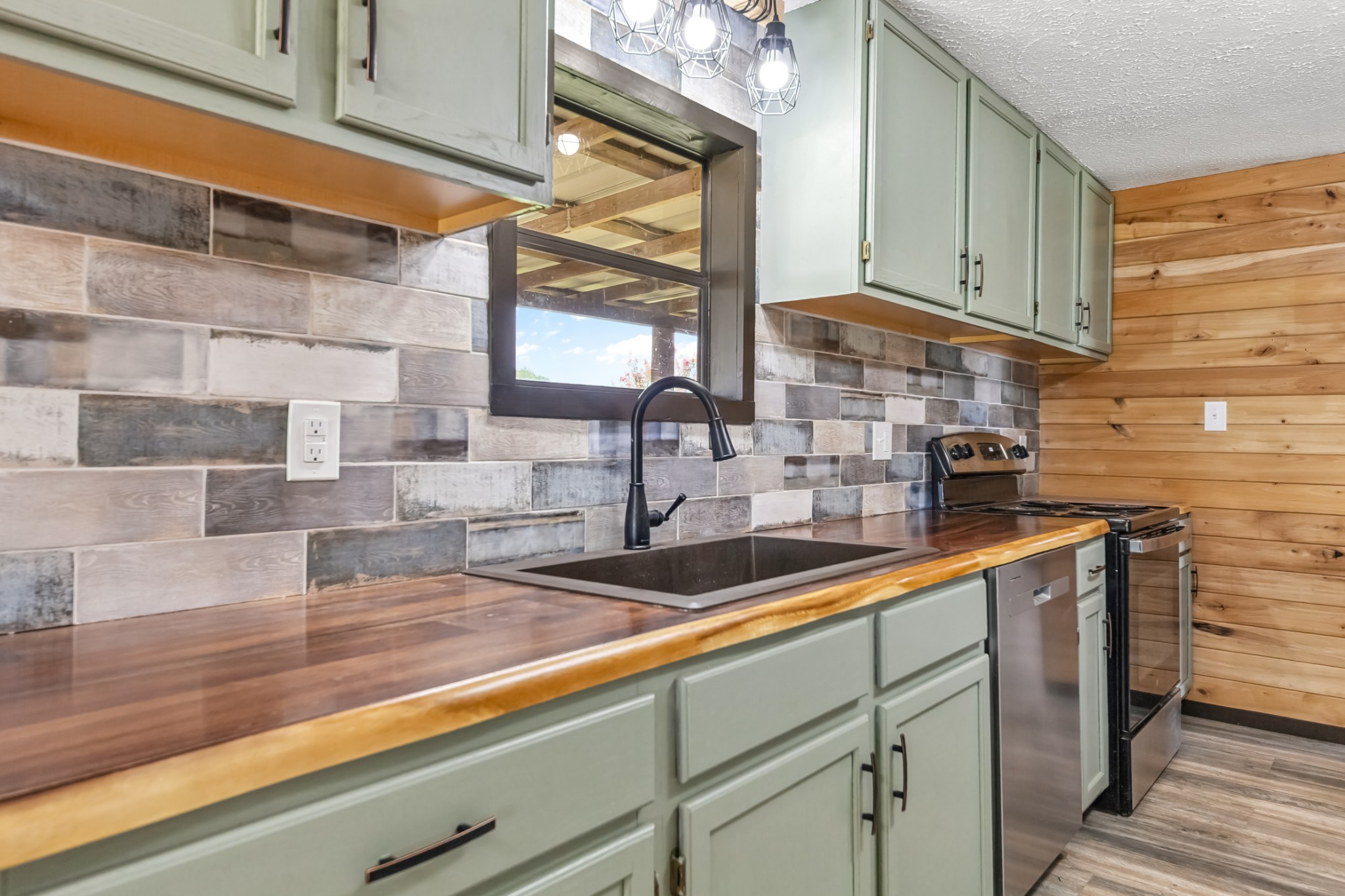 915 Maddox Road Centerville, TN 37033 - Photo 9 of 90 a kitchen with a sink and cabinets