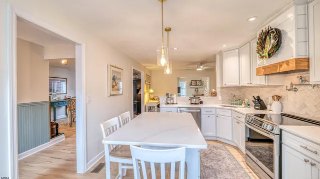 a living room with furniture and a mirror