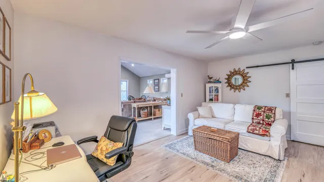 a living room with furniture and a window