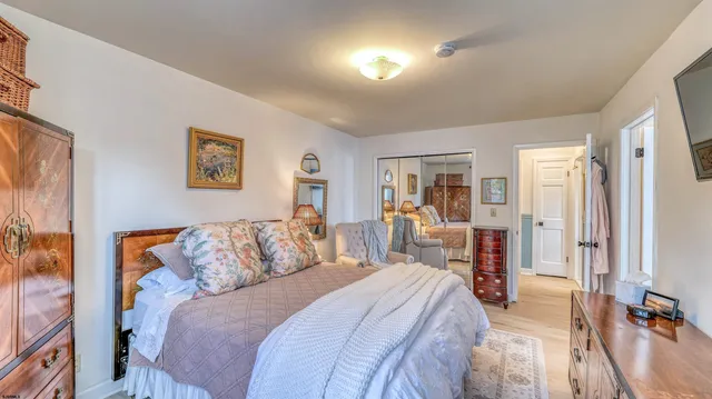 a bathroom with a sink vanity mirror and toilet