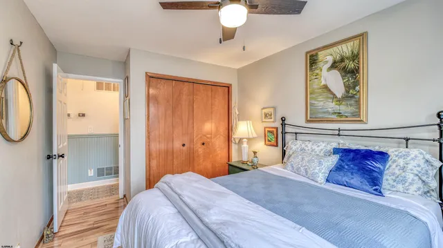 a bathroom with a toilet a sink and a mirror