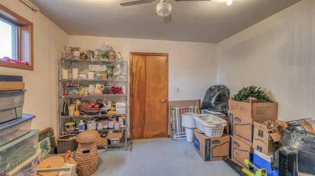 a view of a chairs and table in the balcony