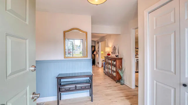 a view of a livingroom with furniture and a window