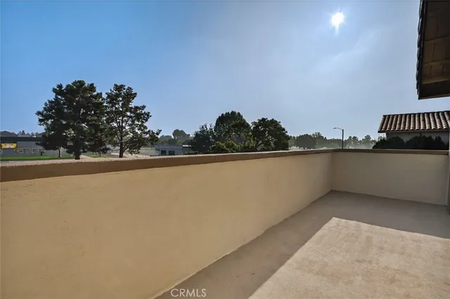 a view of balcony with furniture