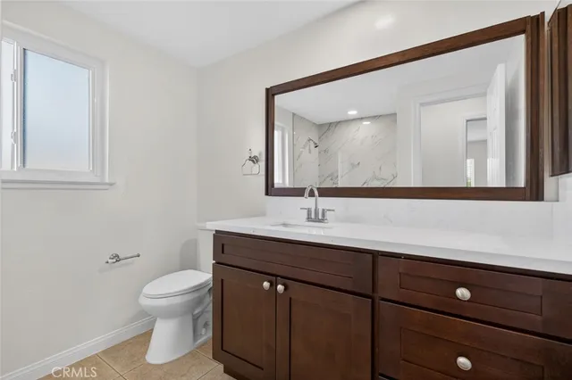 a view of a garden with a building in the background