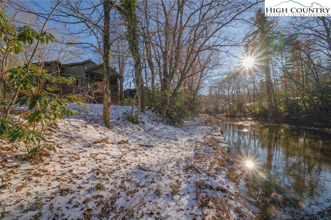 208 Meadow Loop Newland, NC 28657 - Photo 41 of 46 a backyard of a house with lots of green space
