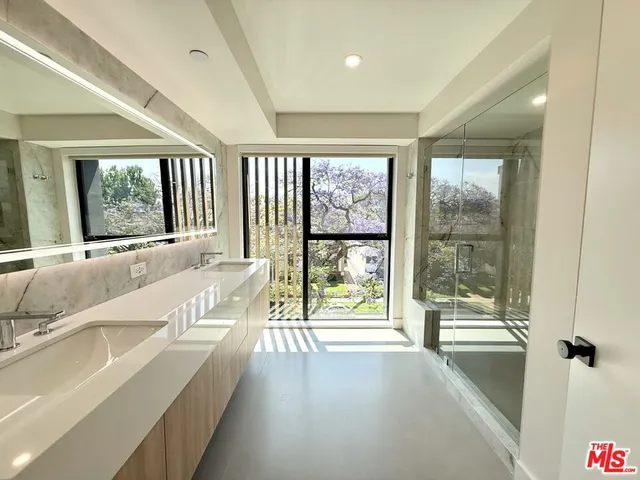 a spacious bathroom with a large tub and shower