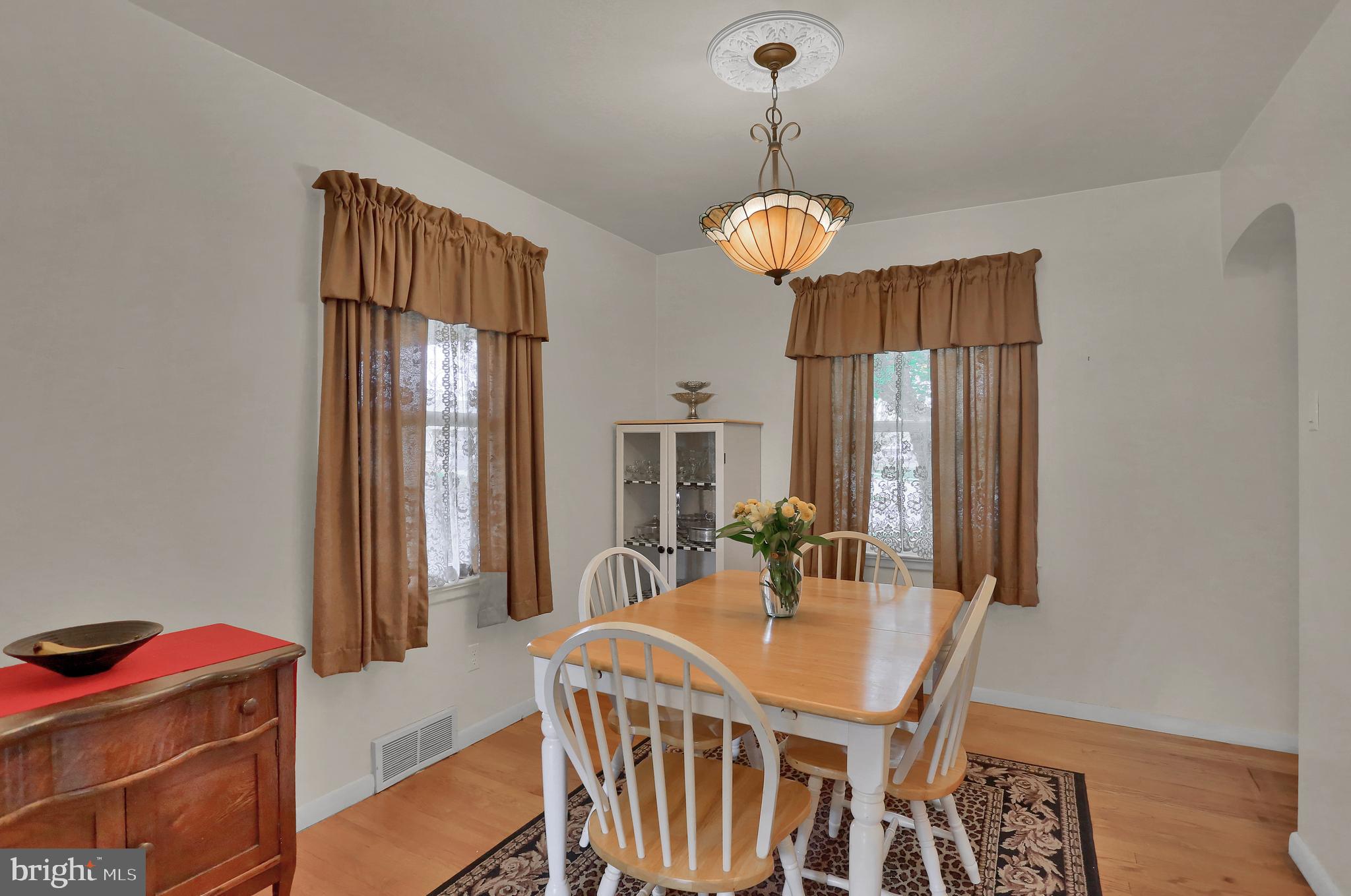 741 Gunnison Road York, PA 17404 - Photo 11 of 35 a view of a dining room with furniture window and wooden floor