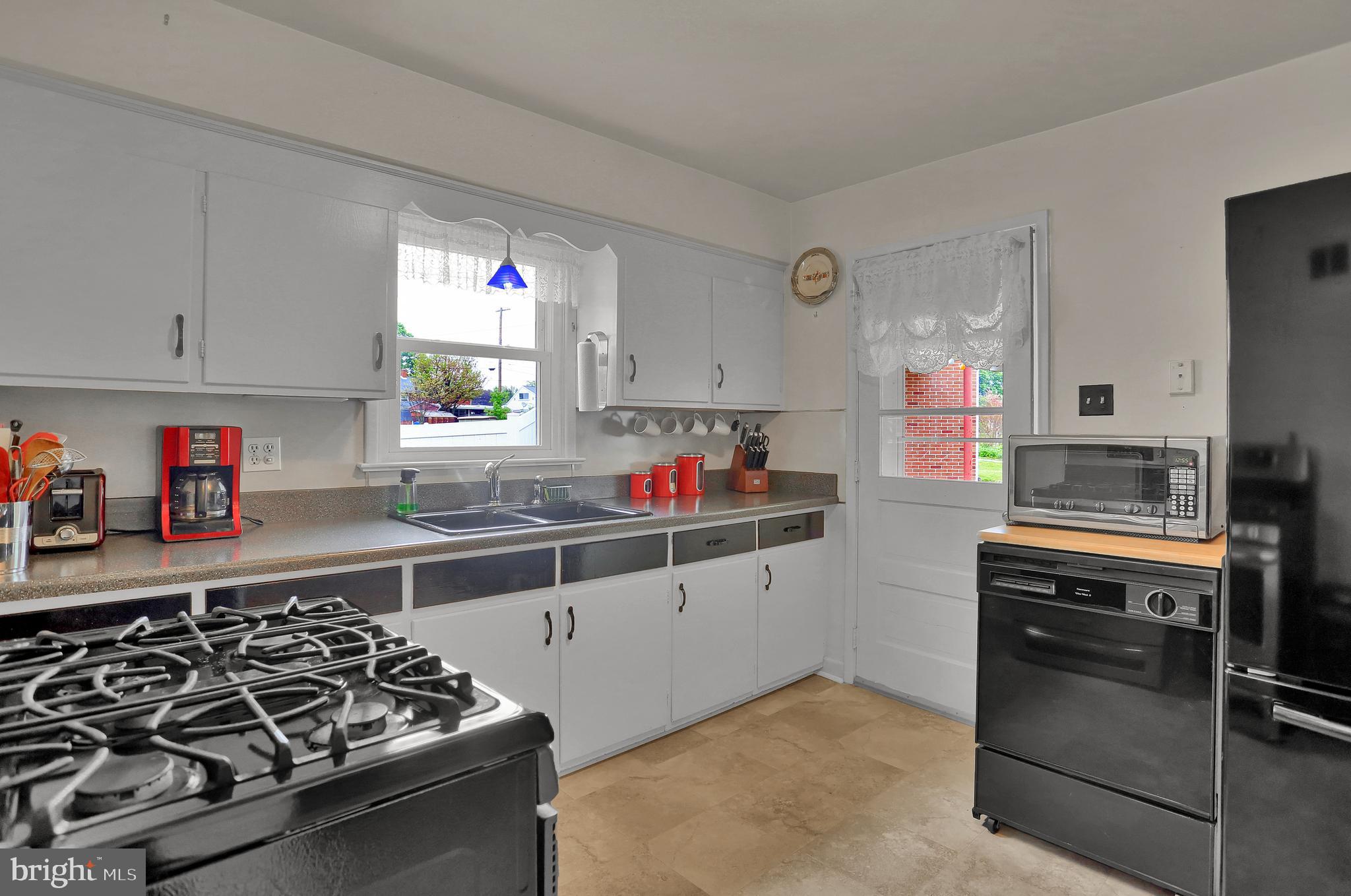 741 Gunnison Road York, PA 17404 - Photo 12 of 35 a kitchen with kitchen island a stove and a sink