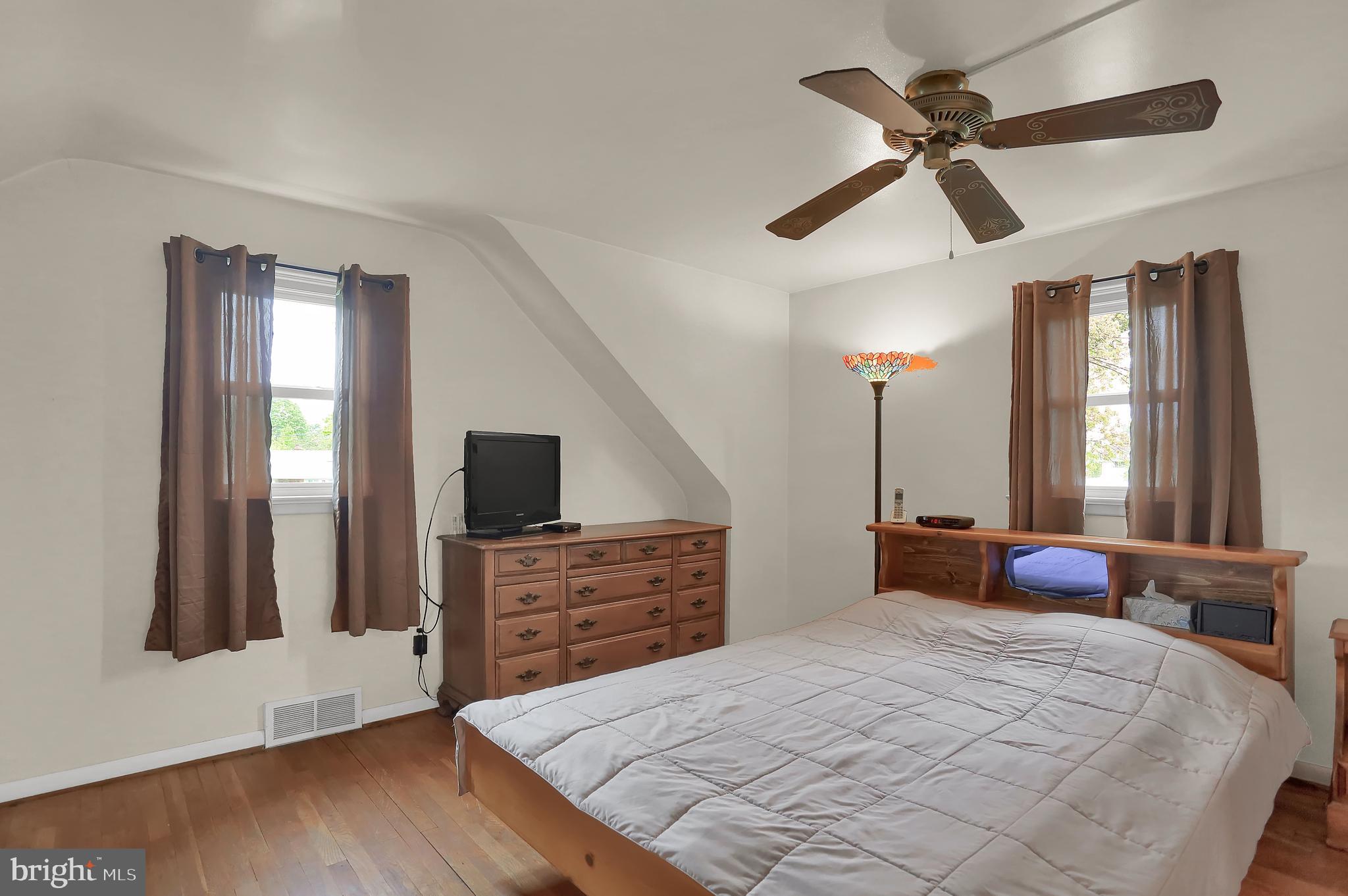 741 Gunnison Road York, PA 17404 - Photo 20 of 35 a bedroom with a bed and a flat tv screen on dresser