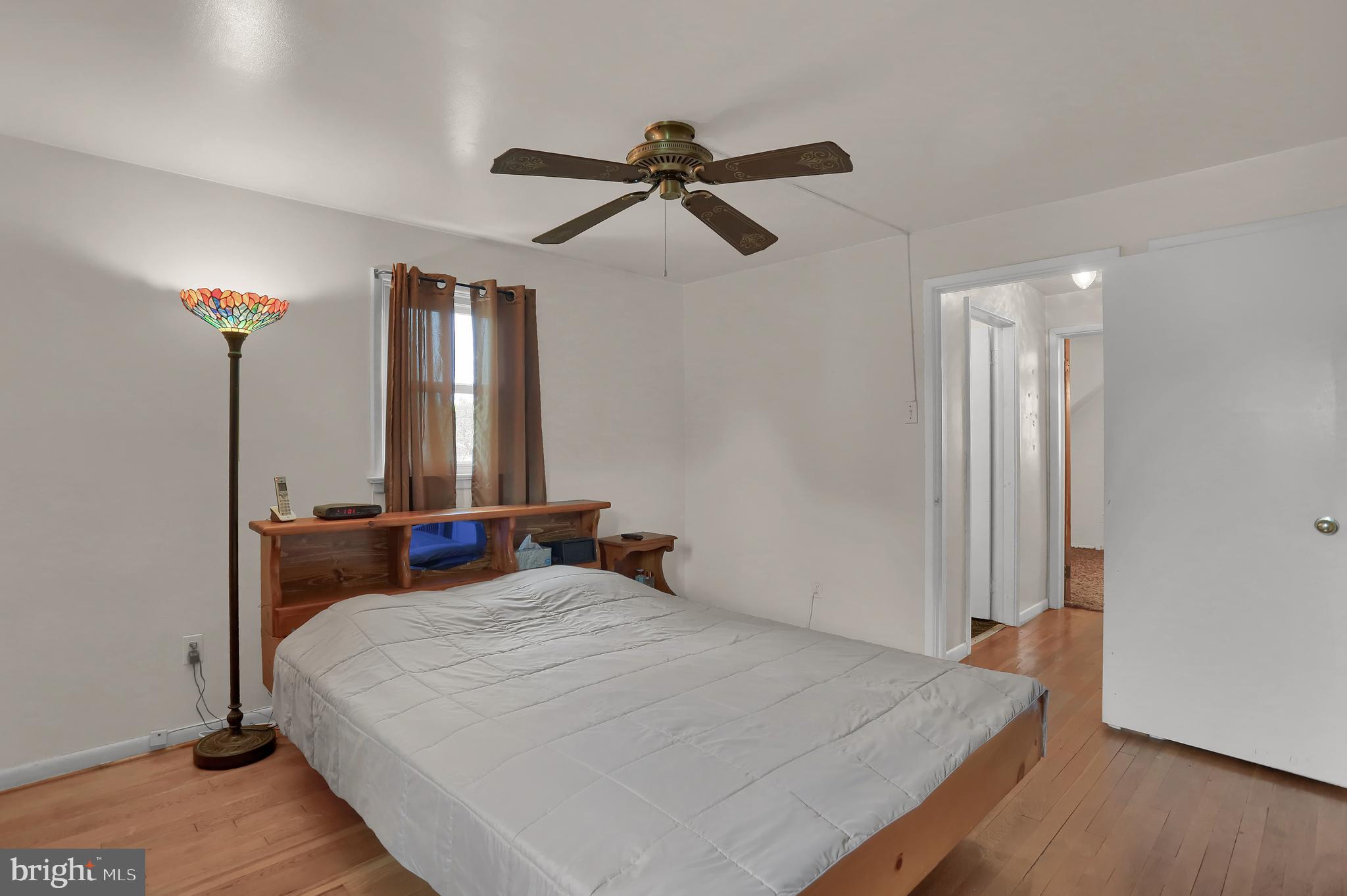 741 Gunnison Road York, PA 17404 - Photo 21 of 35 a bedroom with a bed and a chandelier