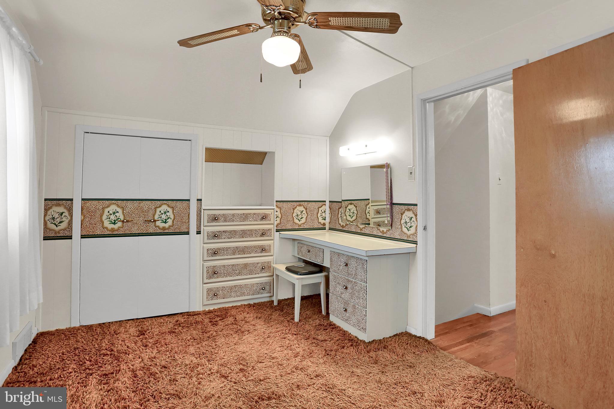 741 Gunnison Road York, PA 17404 - Photo 25 of 35 a bedroom with a bed and a chandelier