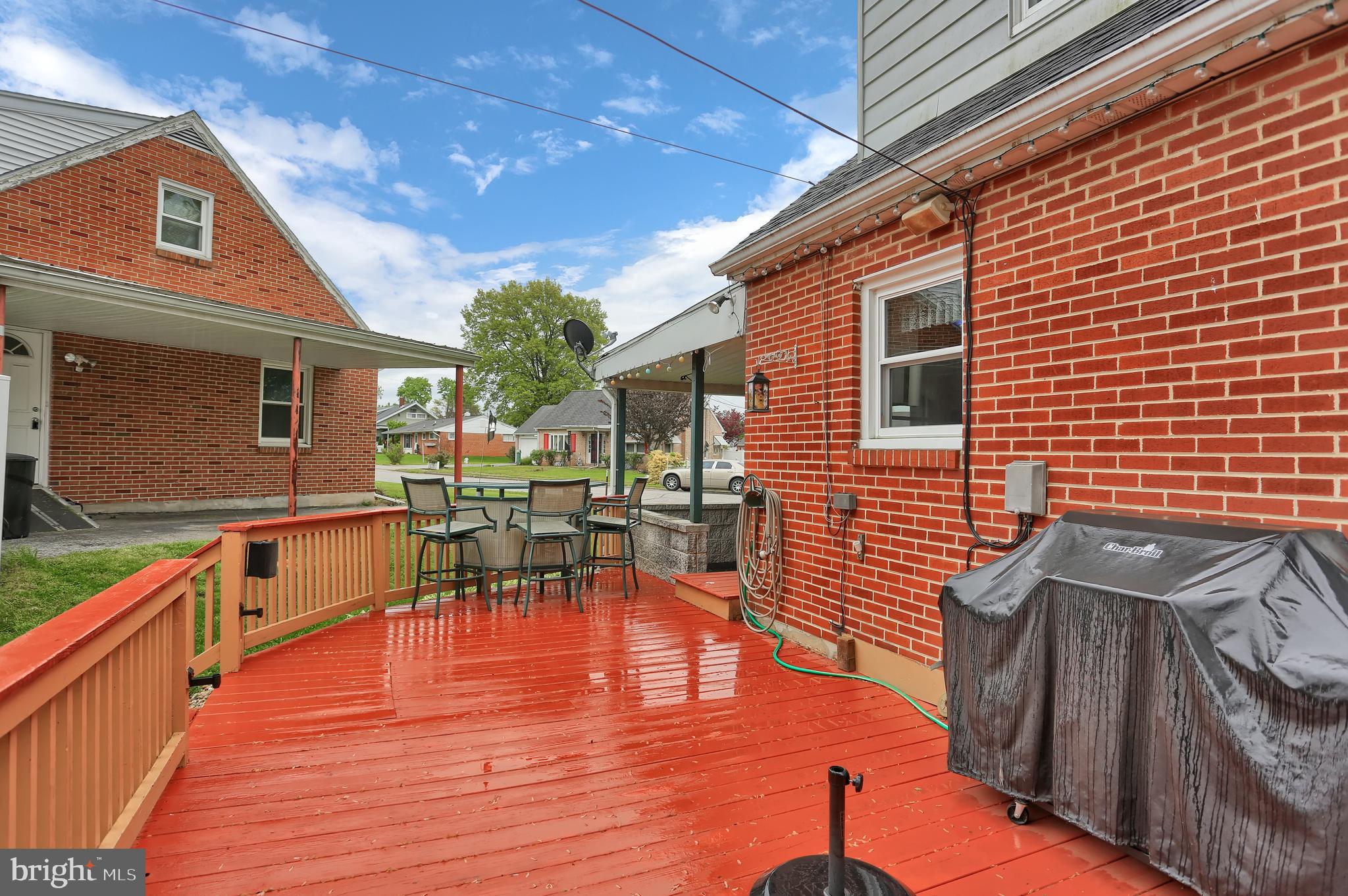 741 Gunnison Road York, PA 17404 - Photo 30 of 35 a view of a patio with table and chairs with wooden floor and fence