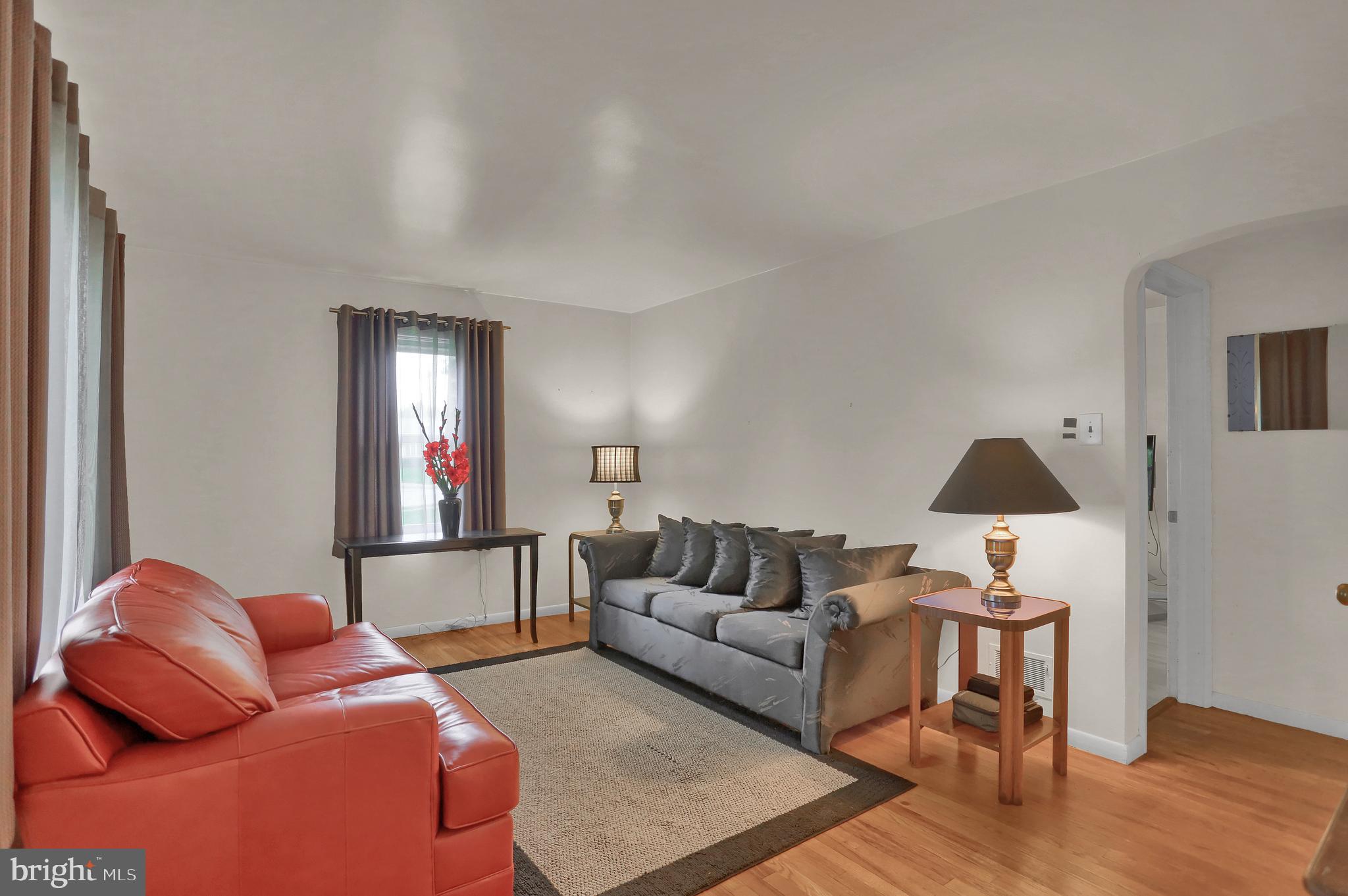 741 Gunnison Road York, PA 17404 - Photo 4 of 35 a living room with furniture and a lamp