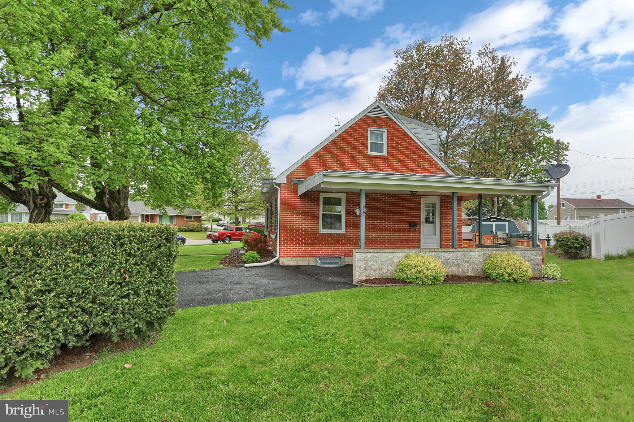 741 Gunnison Road York, PA 17404 - Photo 34 of 35 a front view of a house with a garden and yard
