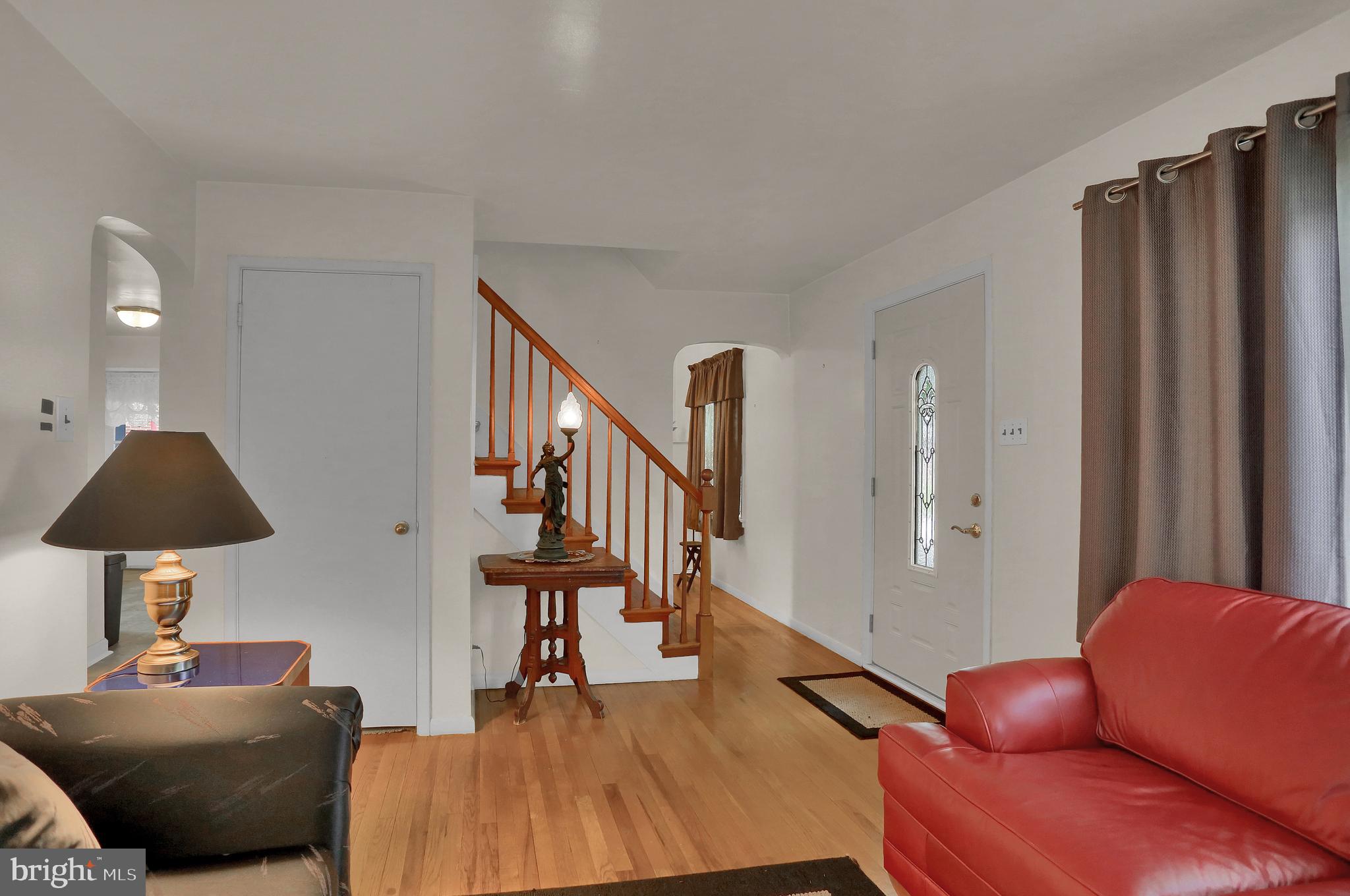 741 Gunnison Road York, PA 17404 - Photo 7 of 35 a living room with furniture and a lamp