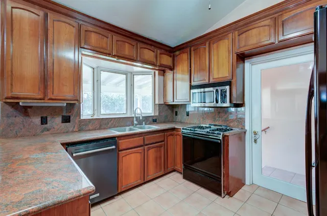a view of a livingroom with furniture and staircase
