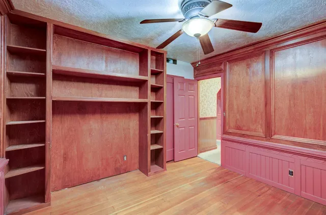 a view of a patio with table and chairs next to a yard