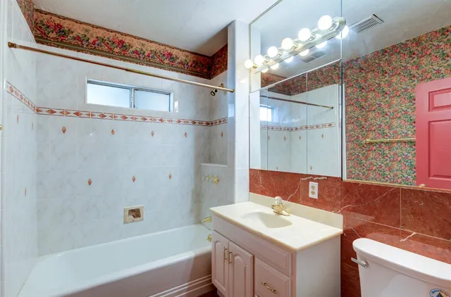 a view of a porch with furniture and a backyard