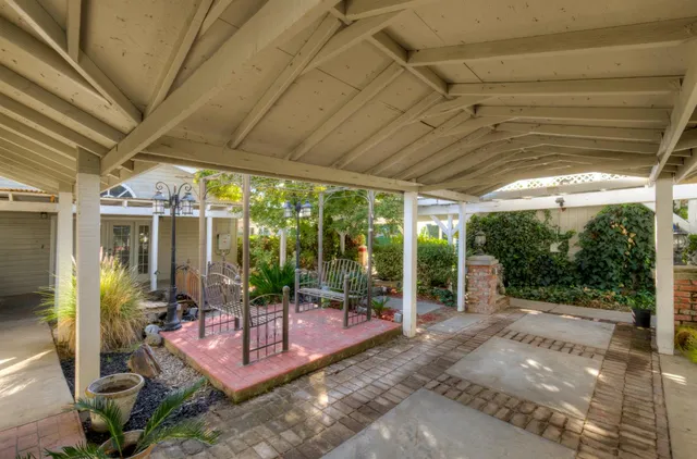 a view of a house with swimming pool and yard