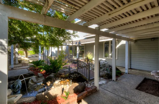 a view of a house with a backyard