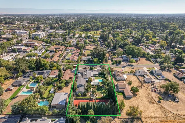 a kitchen with stainless steel appliances granite countertop a stove and a refrigerator