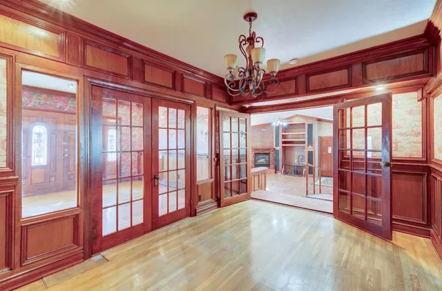 a large kitchen with stainless steel appliances granite countertop a stove a sink dishwasher and a refrigerator