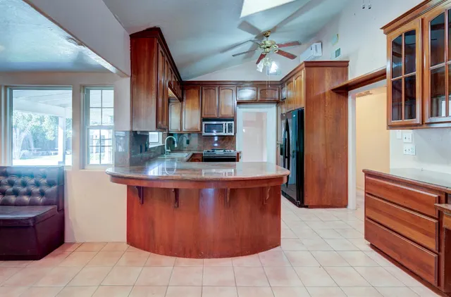 a kitchen with stainless steel appliances granite countertop cabinets and a sink