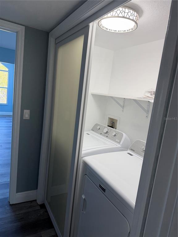 9794 Indian Key Trail, Unit 91 Seminole, FL 33776 - Photo 13 of 20 a utility room with dryer and washer