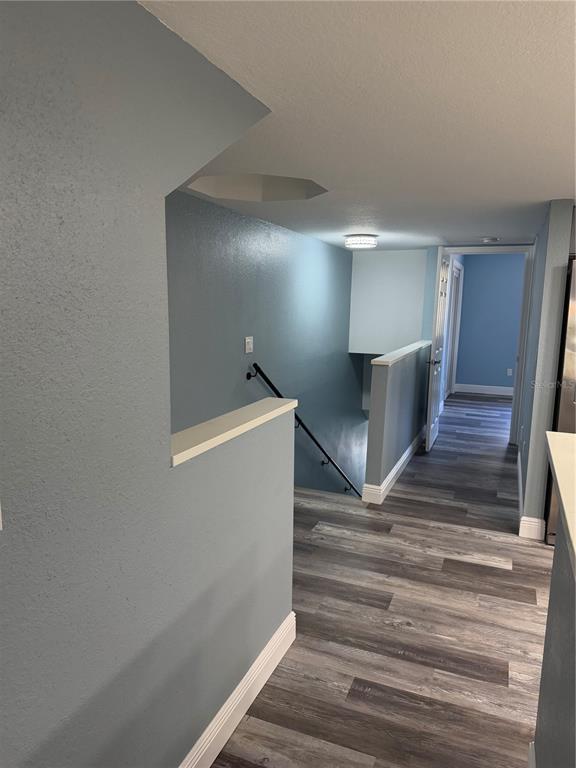 9794 Indian Key Trail, Unit 91 Seminole, FL 33776 - Photo 18 of 20 a view of entryway and hall with wooden floor