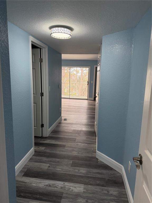 9794 Indian Key Trail, Unit 91 Seminole, FL 33776 - Photo 6 of 20 a view of entryway with wooden floor