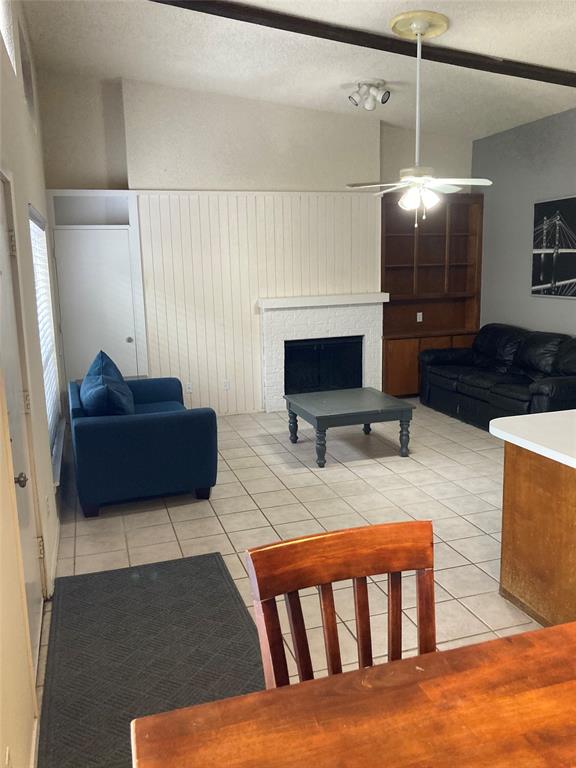 2714 McCart Avenue, Unit 2712 Fort Worth, TX 76110 - Photo 16 of 39 a living room with furniture and a flat screen tv