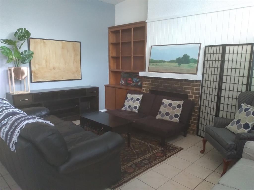 2714 McCart Avenue, Unit 2712 Fort Worth, TX 76110 - Photo 2 of 39 a living room with furniture