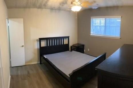 2714 McCart Avenue, Unit 2712 Fort Worth, TX 76110 - Photo 24 of 39 a bedroom with a bed and a window